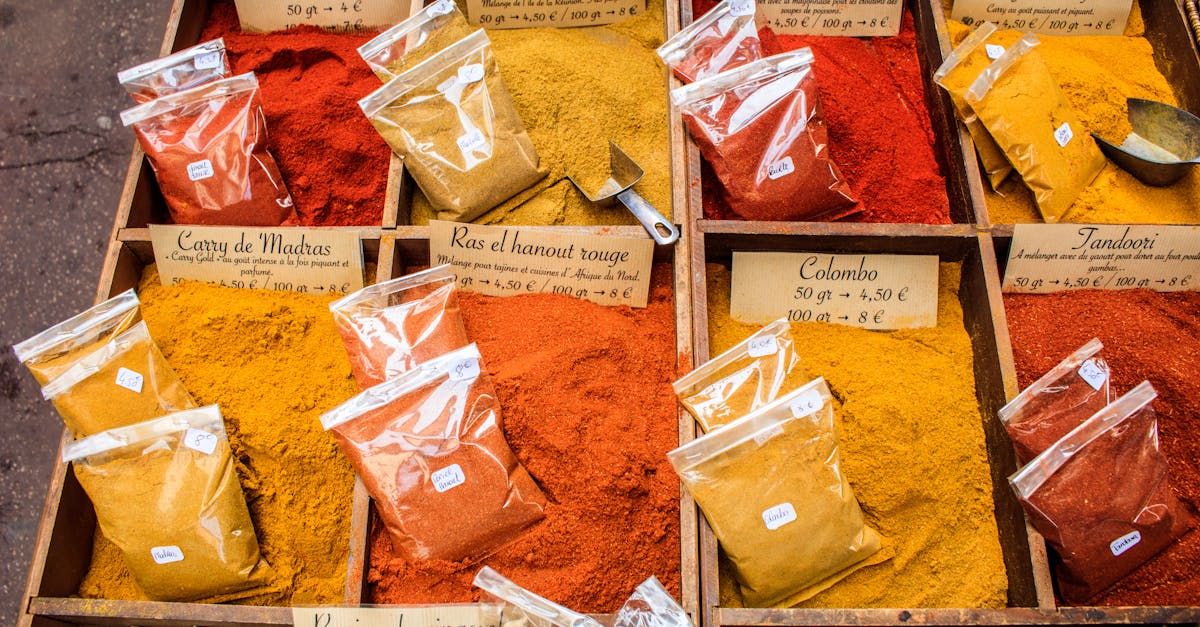 Vibrant spices displayed at a local market in Nice, France, showcasing diverse colors and flavors.